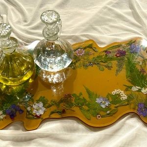Handmade resin display or cutting board filled with flowers. Neutral color.